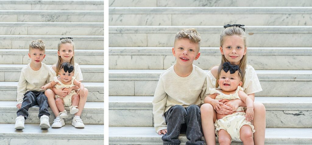 a brother, sister, and their baby sister sit on the marble steps of the grand staircase inside the Utah State Capitol