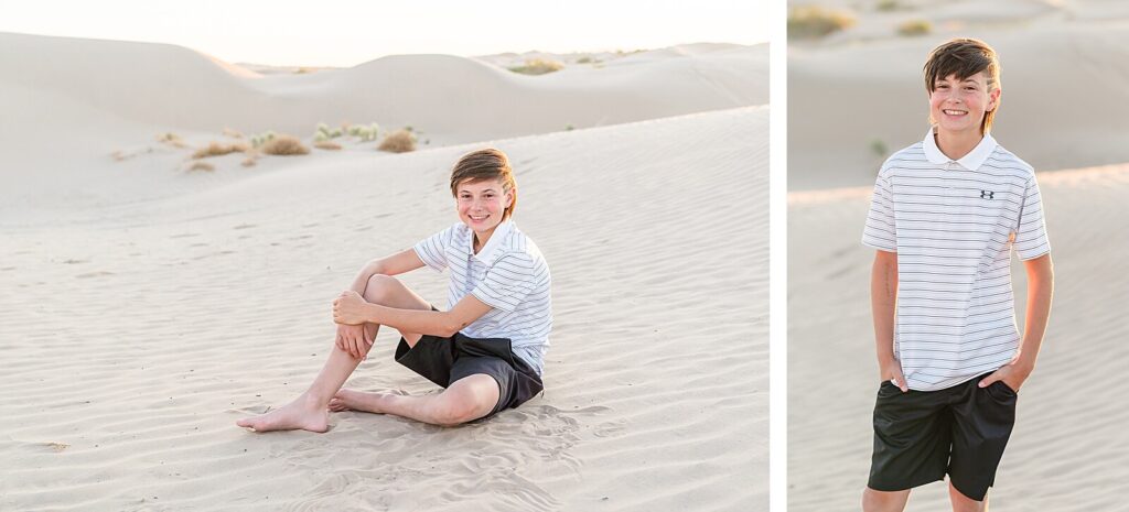 a boy wearing a white polo shirt and black shorts sits in the sand at Little Sahara, Nephi at sunset